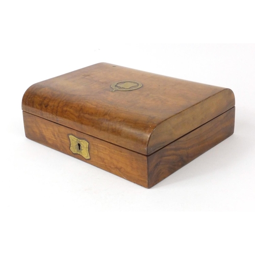 2269 - Burr walnut dome topped writing box with brass cartouche and escutcheon, 27cm long