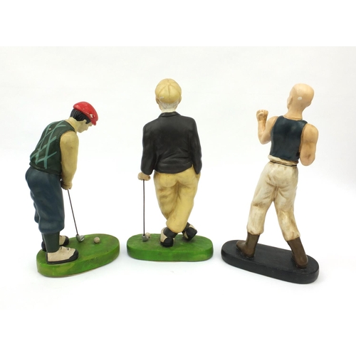 262 - Two decorative ceramic models of golfers and a decorative ceramic model of a boxer, the largest 40cm... 