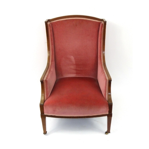 2045 - Edwardian inlaid mahogany open armchair with pink upholstery raised and tapering legs, 91cm high
