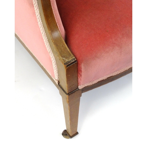 2045 - Edwardian inlaid mahogany open armchair with pink upholstery raised and tapering legs, 91cm high
