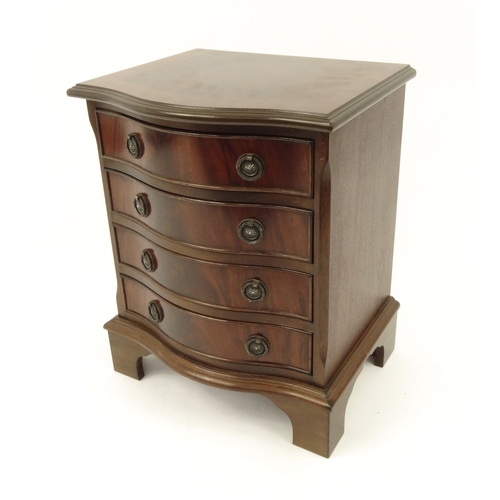 2047 - Mahogany serpentine front, four drawer chest of small proportions, 52cm high x 42cm wide x 35cm deep