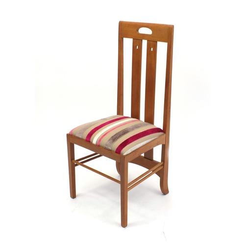 2035 - Charles Rennie McIntosh design light oak dining table, together with six dining chairs including two... 
