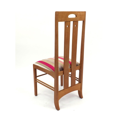 2035 - Charles Rennie McIntosh design light oak dining table, together with six dining chairs including two... 