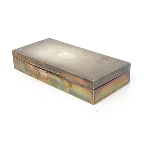 758 - Rectangular silver cigarette box with engine turned decoration and blank cartouche, London 1932, 19.... 