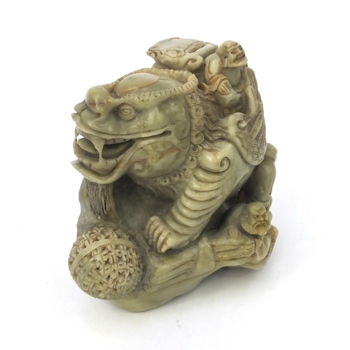 542 - Chinese soapstone carving of a mythical beast and three elders, 16cm high