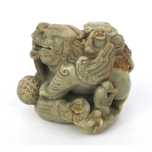 542 - Chinese soapstone carving of a mythical beast and three elders, 16cm high