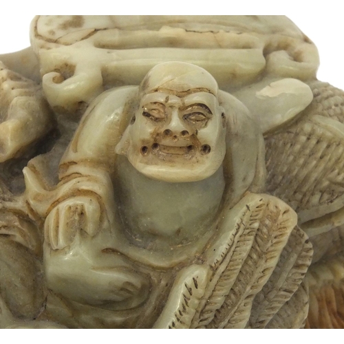 542 - Chinese soapstone carving of a mythical beast and three elders, 16cm high