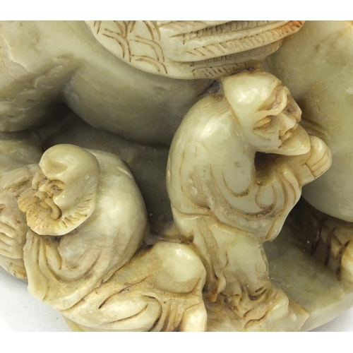 542 - Chinese soapstone carving of a mythical beast and three elders, 16cm high