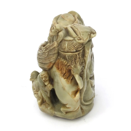 542 - Chinese soapstone carving of a mythical beast and three elders, 16cm high