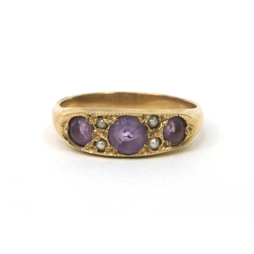 879 - 9ct gold amethyst and seed pearl ring, size M, approximate weight 2.8g