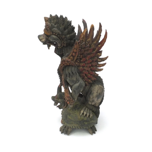 553 - Oriental Chinese painted root carving of two mythical beasts, 53cm high