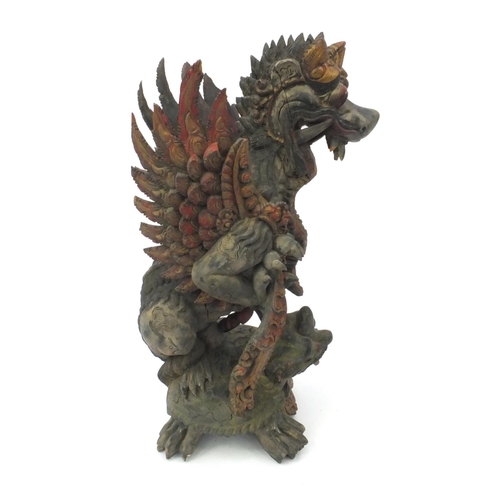 553 - Oriental Chinese painted root carving of two mythical beasts, 53cm high