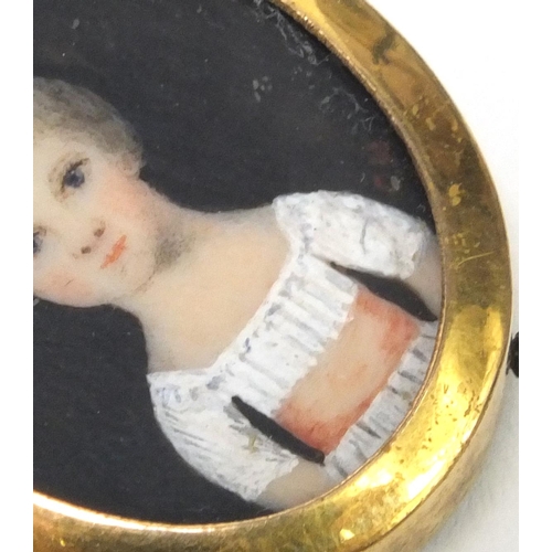 27 - Oval portrait miniature of a child, monogrammed CH, housed in a gilt metal frame, 2.5cm high excludi... 