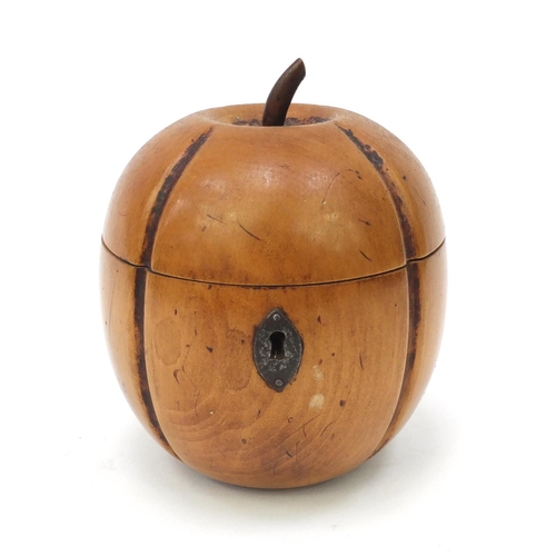 65 - Fruit wood tea caddy in the form of an apple, 13cm high