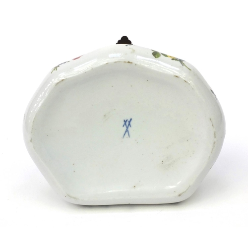 591 - Continental porcelain box with hinged lid hand painted with flowers and foliage, cross sword marks t... 