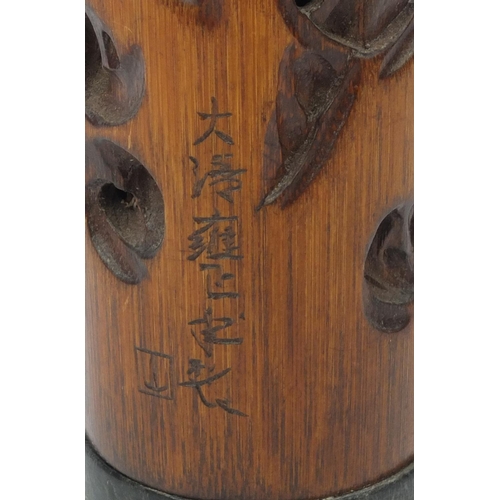 554 - Chinese bamboo cricket cage carved with elders amongst trees, character marks to the side, 23cm high