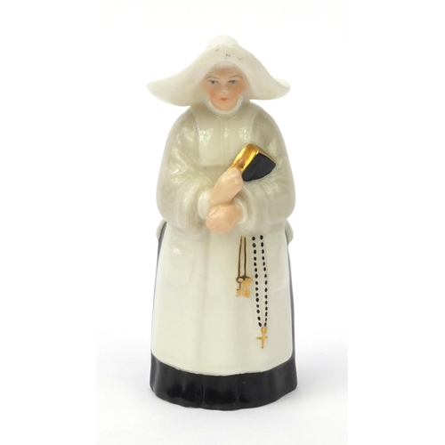 607 - Royal Worcester candle snuffer in the form of a Nunn, factory marks to the inside, 9.5cm high