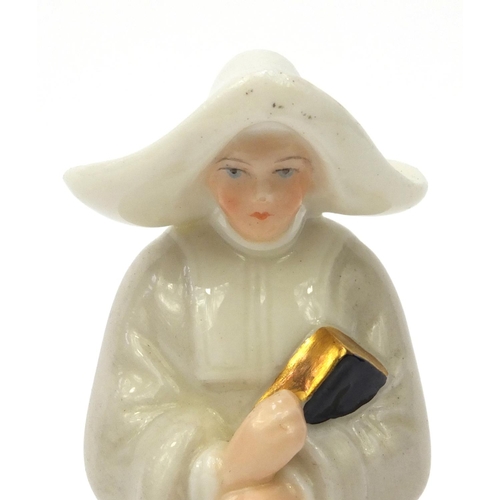607 - Royal Worcester candle snuffer in the form of a Nunn, factory marks to the inside, 9.5cm high