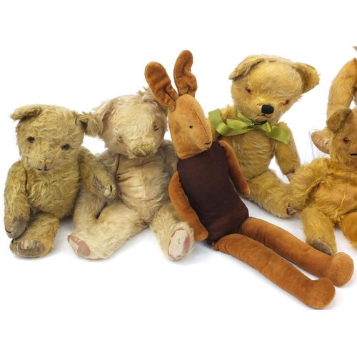 444 - Group of seven mostly golden teddy bears including some straw filled with jointed limbs, the tallest... 