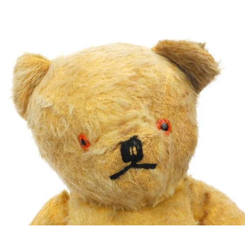 444 - Group of seven mostly golden teddy bears including some straw filled with jointed limbs, the tallest... 