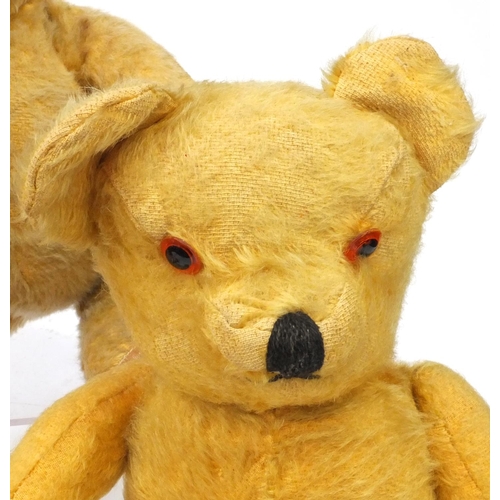 444 - Group of seven mostly golden teddy bears including some straw filled with jointed limbs, the tallest... 