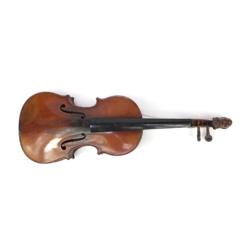 349 - Two old wooden violins, one with figural scroll and Gaspard duiffo Praggard label, the other with an... 