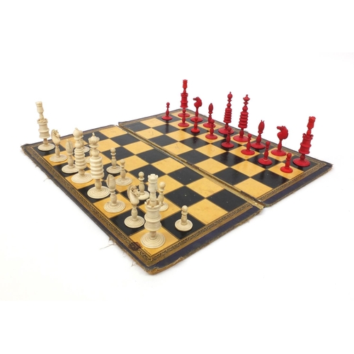 411 - **DESCRIPTION AMENDED 6/9** Half stained turned ivory part chess set with chess board, the tallest p... 