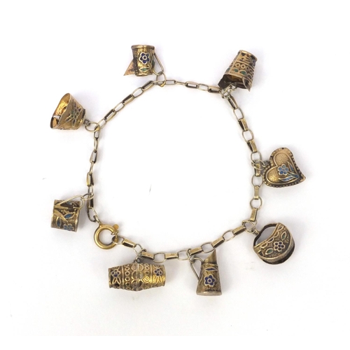 530 - Chinese silver gilt charm bracelet with a selection of charms including a jug, basket and heart