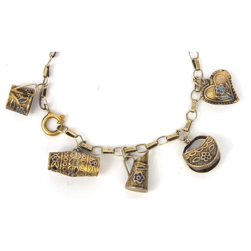 530 - Chinese silver gilt charm bracelet with a selection of charms including a jug, basket and heart