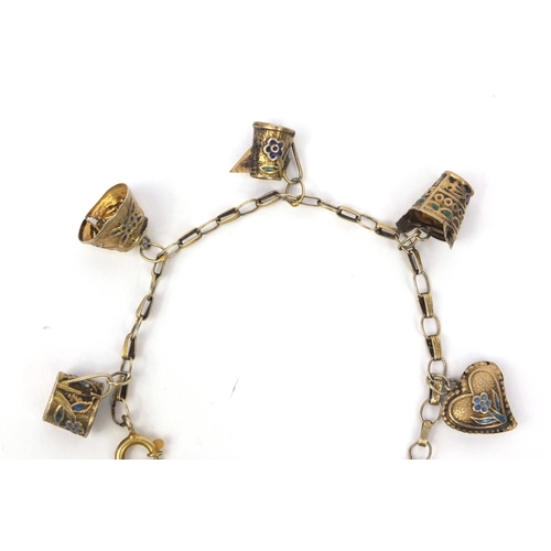 530 - Chinese silver gilt charm bracelet with a selection of charms including a jug, basket and heart