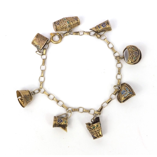 530 - Chinese silver gilt charm bracelet with a selection of charms including a jug, basket and heart