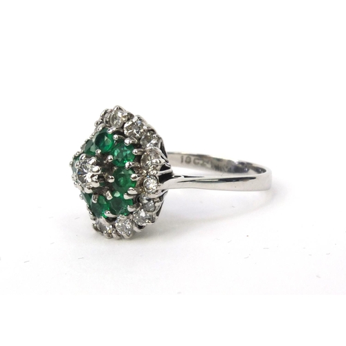 848 - 18ct white gold emerald and diamond cluster ring, size M, approximate weight 5.6g