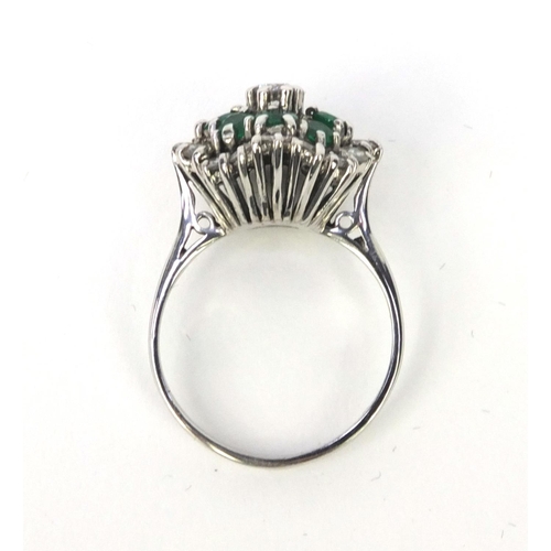 848 - 18ct white gold emerald and diamond cluster ring, size M, approximate weight 5.6g