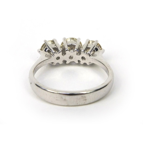 820 - 18ct gold three stone brilliant cut diamond ring, size L, approximate weight 4.0g