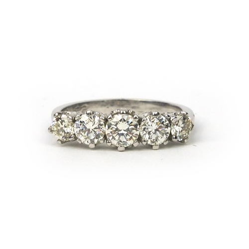 828 - 18ct gold five stone brilliant cut diamond ring, size N, approximate weight 3.8g