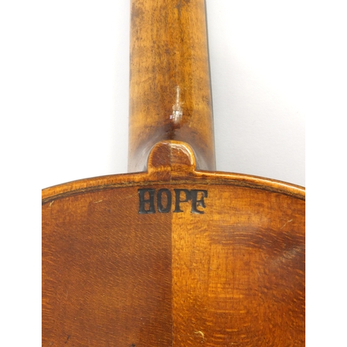 345 - Old wooden violin, the back stamped 'Hope', together with two bows wth mother of pearl frogs and a G... 