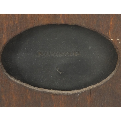 609 - Wegdwood black basalt plaque depicting a classical Greek male carrying two wild boar, factory marks ... 