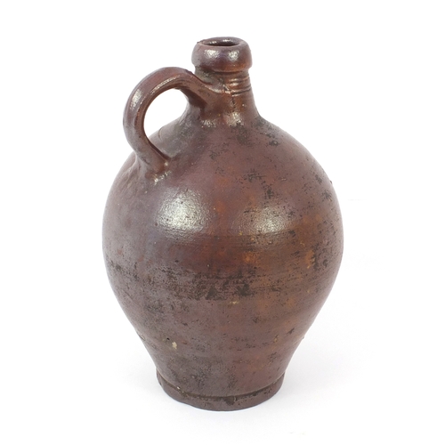 622 - Brown salt glazed stoneware bellarmine jug, 27cm high