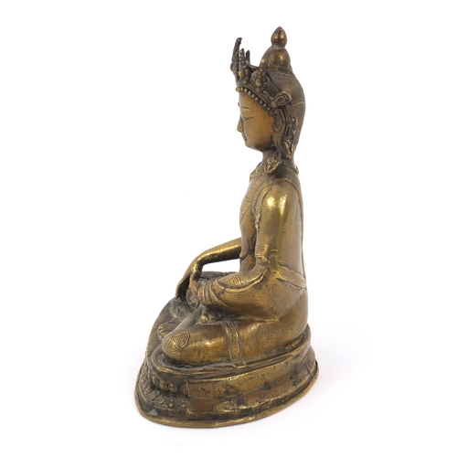 565 - Chinese Chino-Tibetan buddha sat in the lotus posistion, 21cm high