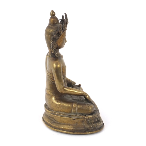 565 - Chinese Chino-Tibetan buddha sat in the lotus posistion, 21cm high