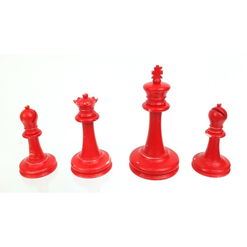 409 - Cantonese turned ivory half stained chess set, the tallest piece, 9cm high