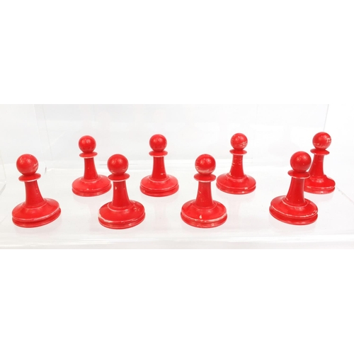 409 - Cantonese turned ivory half stained chess set, the tallest piece, 9cm high