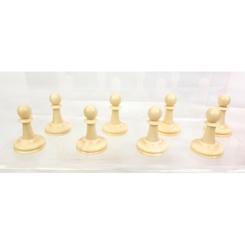 409 - Cantonese turned ivory half stained chess set, the tallest piece, 9cm high