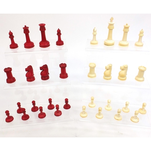 410 - Cantonese turned ivory half stained chess set, the tallest piece 10cm high