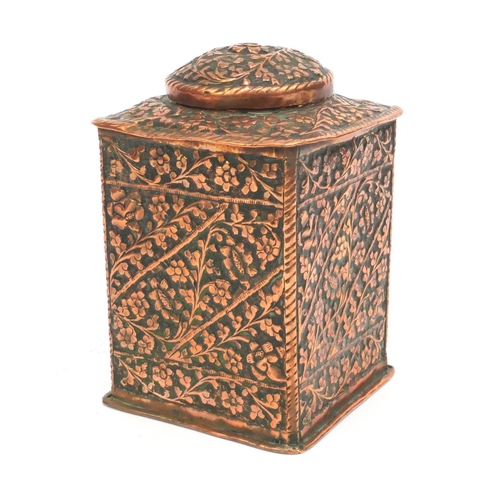 329 - Middle Eastern copper square tea caddy profusely embossed with flowers and foliage, 17cm high