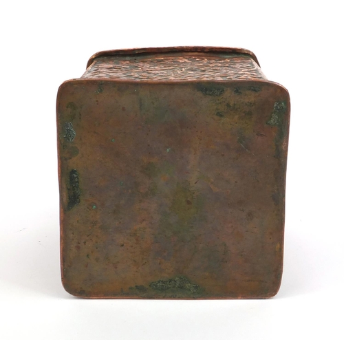 329 - Middle Eastern copper square tea caddy profusely embossed with flowers and foliage, 17cm high