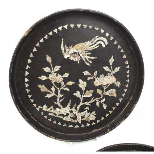 558 - Two Chinese black lacquered trays together with one other, each inlaid with Mother of Pearl and deco... 