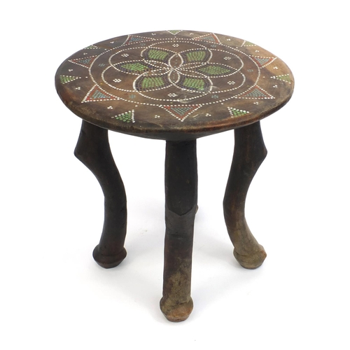 335 - African hardwood and beadwork stool, the top with a geometric design, 30cm high