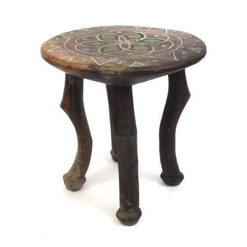 335 - African hardwood and beadwork stool, the top with a geometric design, 30cm high