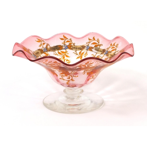 634 - Moser pink and clear glass pedestal dish with frilled rim, hand painted and gilded with flowers, fac... 